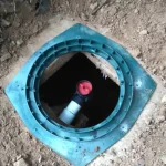 Close up of a septic hole entrance.