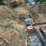 Excavating tools plowing the dirt.