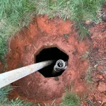 Close up of a septic tank entry hole.