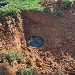 Close-up of a septic tank entry hole.